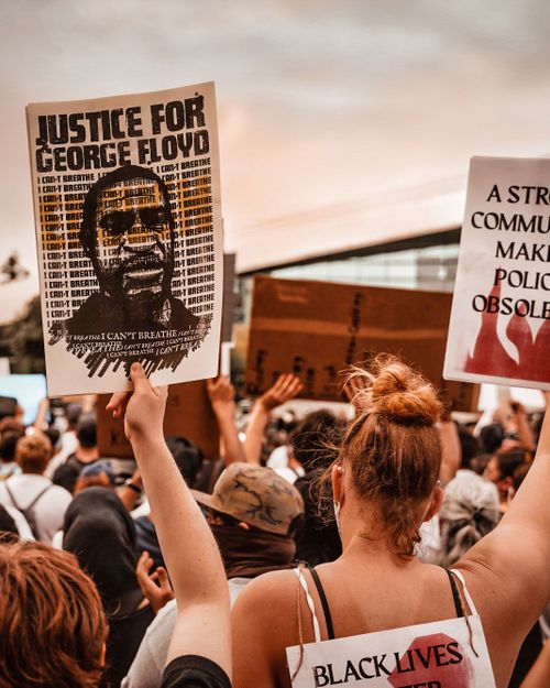 People holding signs at Black Lives Matter rally at Fresno City Hall