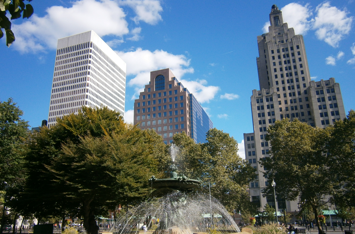Image of the One Financial Plaza tower, 50 Kennedy Plaza building, and the Superman Building, shot from behind the fountain in Burnside Park, looking up.