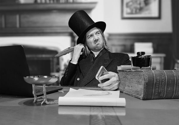 A pensive tycoon at his cluttered wooden desk, with no one nearby to boss around.