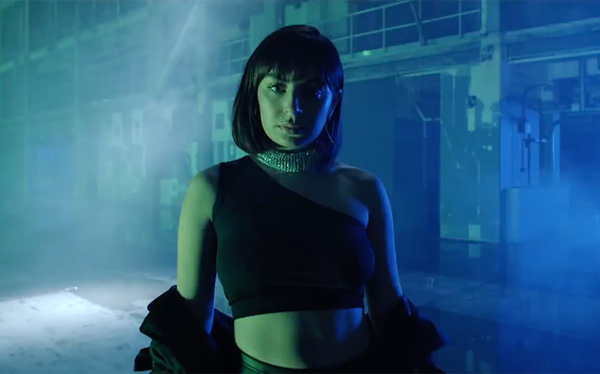 Charli XCX struts in an abandoned warehouse for 5 in the Morning video