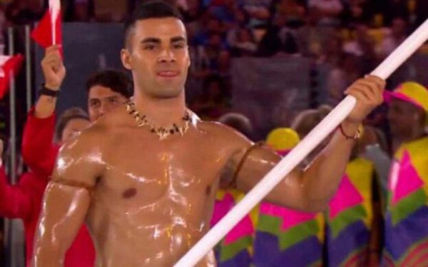 He’s done it again! Tonga’s flag bearer goes bare-chested for Winter Olympics opening ceremony