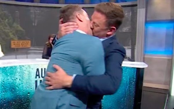 Straight TV presenters kiss on air to raise funds for Red Cross flood victims