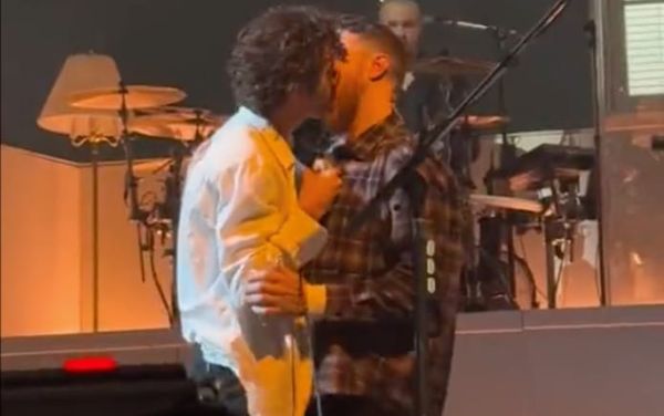 The 1975’s Matty Healy passionately kisses a male fan on stage