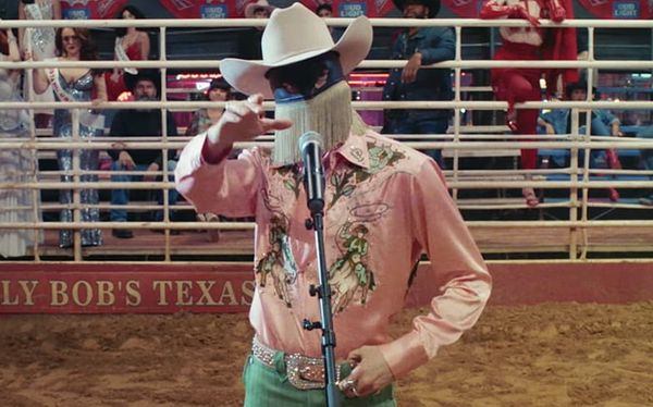 Orville Peck brings drag queens and cowboys to Queen Of The Rodeo video