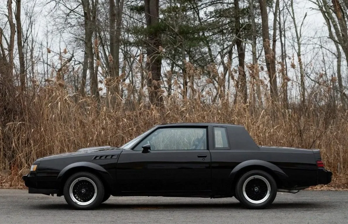 A clean side profile shows the two-door Regal body and blacked-out trim.