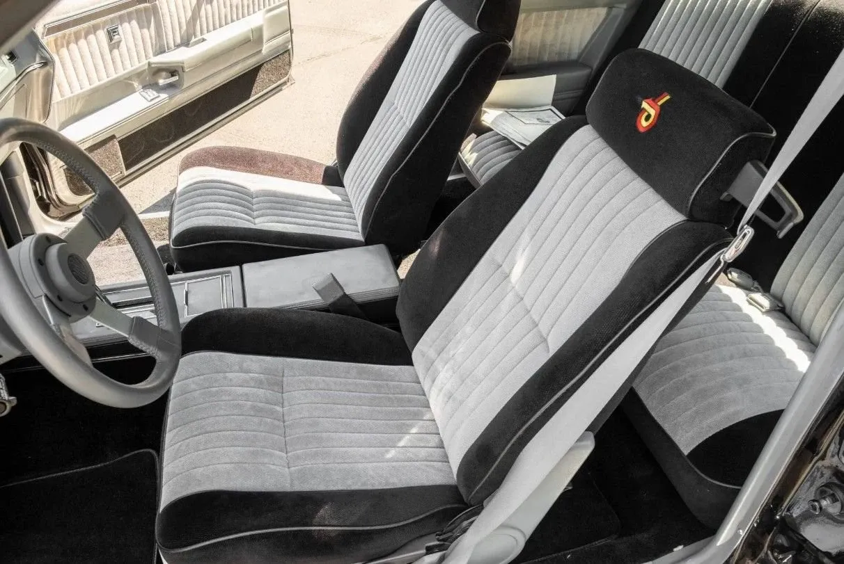 The cabin pairs the build with classic Grand National-style buckets.