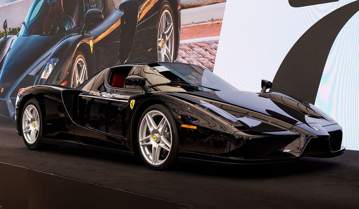 Black 2003 Ferrari Enzo on the auction stage at Broad Arrow’s 2026 Quail Auction