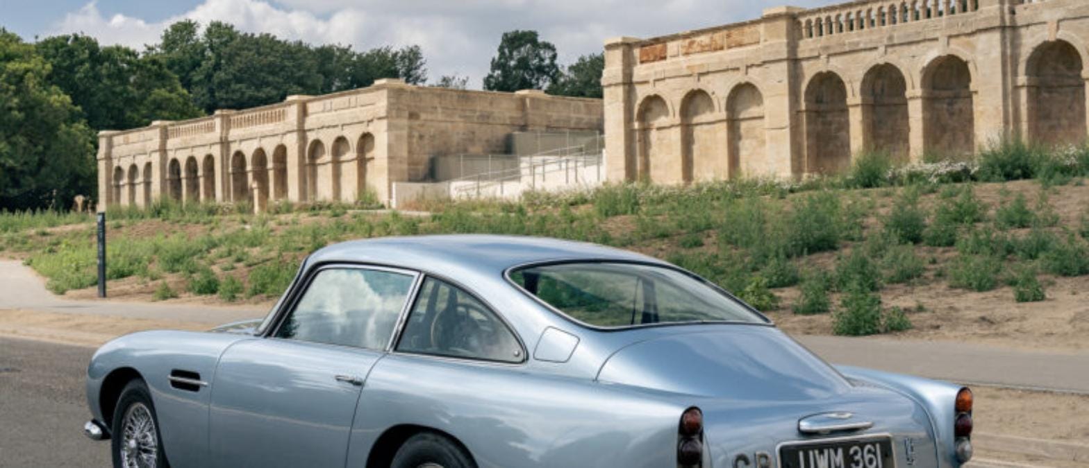 1963 Aston Martin DB5 Sports Saloon, rear three-quarter view showing its Ice Blue paint