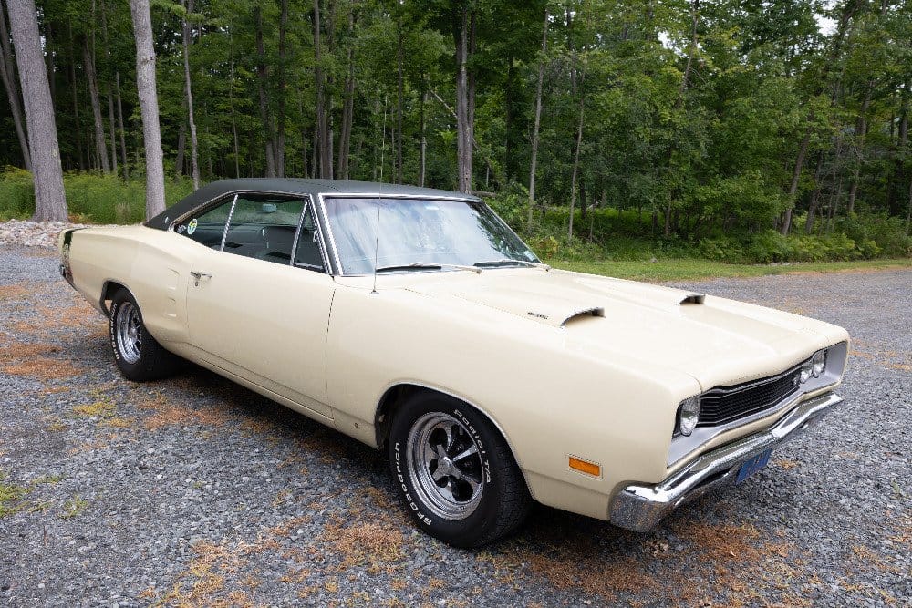 Cream 1969 Dodge Super Bee with green vinyl top