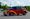 Chopped 1938 Chevrolet Master Deluxe Town Sedan street rod in metallic maroon and pearl orange
