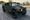 Green AM General M1151A1 HMMWV slantback Humvee on 38-inch tires and Hummer H2 wheels