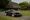 2026 Daytona Shooting Brake Hommage by Niels van Roij Design, based on a Ferrari 599 GTB Fiorano, parked in front of a thatched barn