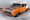 Orange and white supercharged 1955 Chevrolet 210 two-door sedan with flame graphics