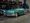 1957 Oldsmobile Starfire 98 convertible in Jade Mist and white, parked in a showroom