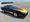 Black 1986 Chevrolet Corvette with flame graphics