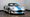Silver 1999 Shelby Series 1 roadster with blue racing stripes