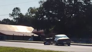 Guy Tumbles Out Of Camaro