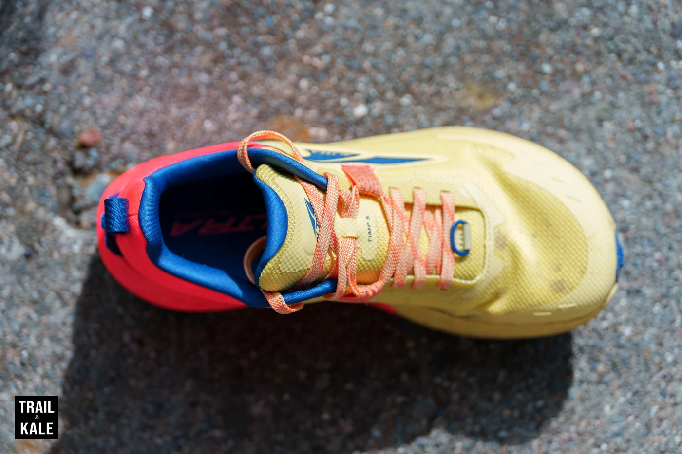 A top-down look at the Altra Timp 5's footshape, upper, laces and cushioning around the tongue and ankle.