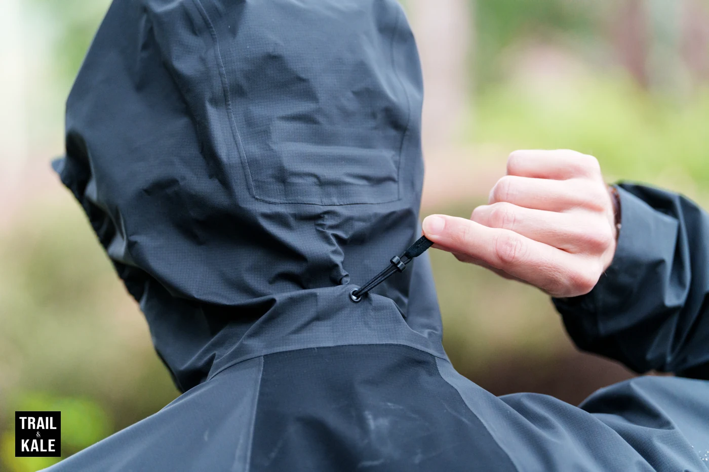 Hood adjustment toggle, and you can see the rectangular RECCO reflector just above it, hidden in the hood