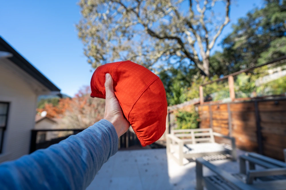 It packs down easily into its own hood or internal mesh pocket