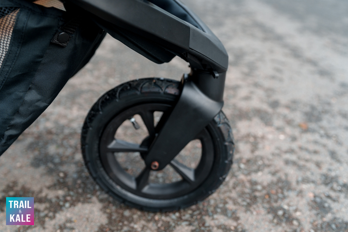 The front wheel on the BOB Wayfinder jogging stroller easily locks in place or releases to swivel 360, by flicking the small plastic lever.