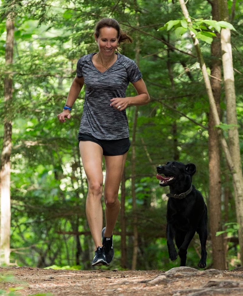 CBD For Dogs Austin and Kat - Kat and her very active senior dog Austin running together - Trail and Kale