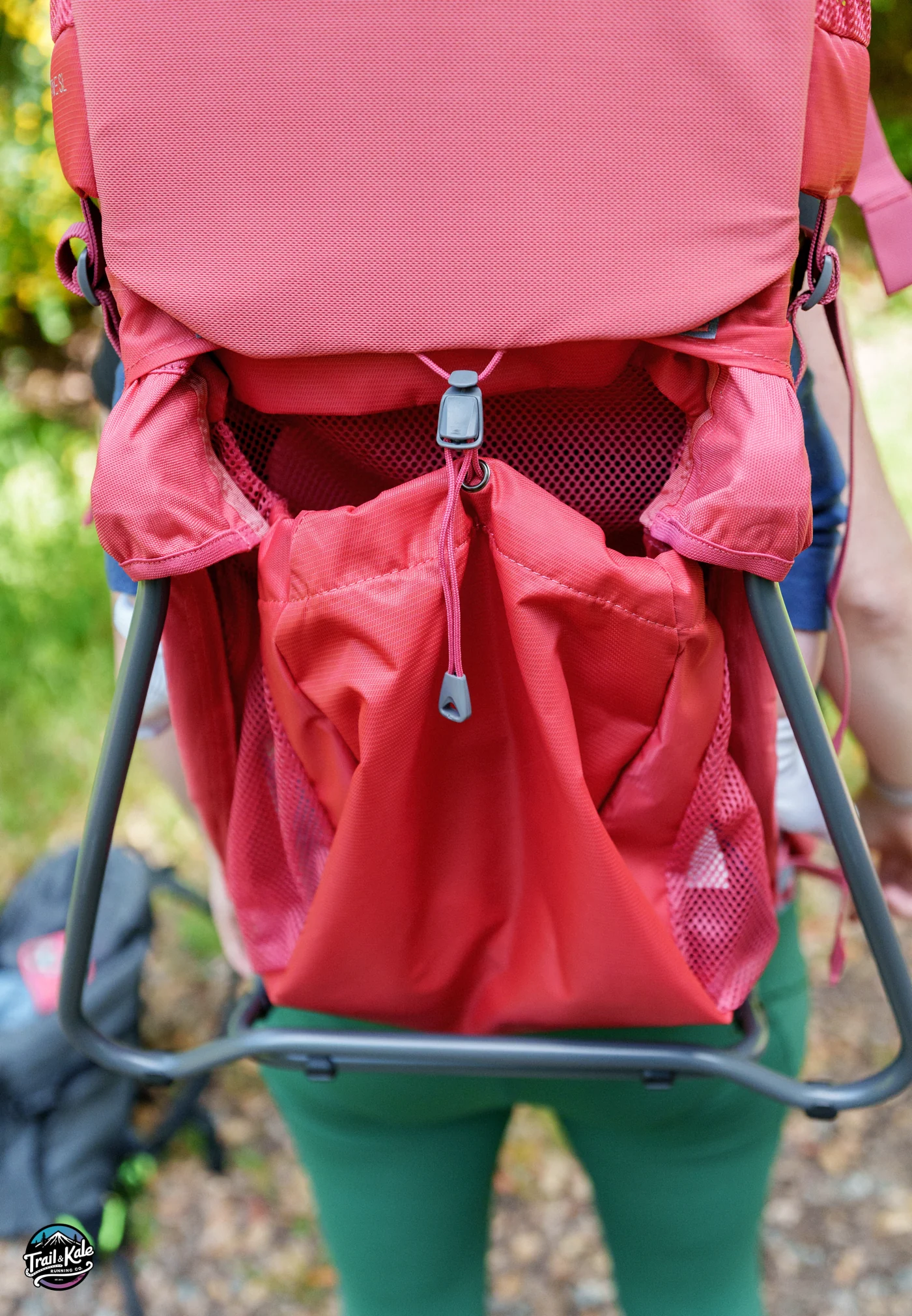The large stuff pocket below the child's seat on the Deuter Kid Comfort child carrier (Active SL)