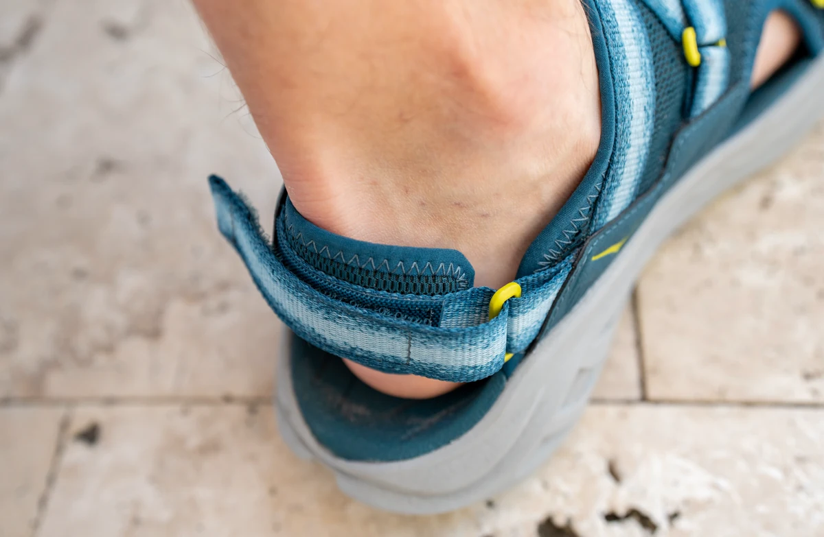 The HOKA Infini Hike TC heel strap is padded and comfortable