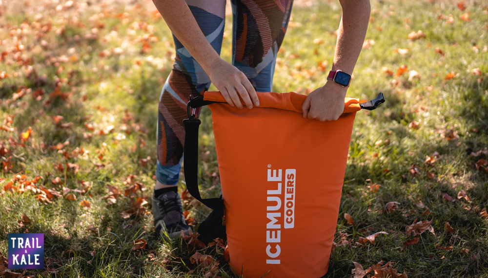 Helen demonstrating how to close the IceMule cooler so it achieves a waterproof seal | IceMule Cooler Review