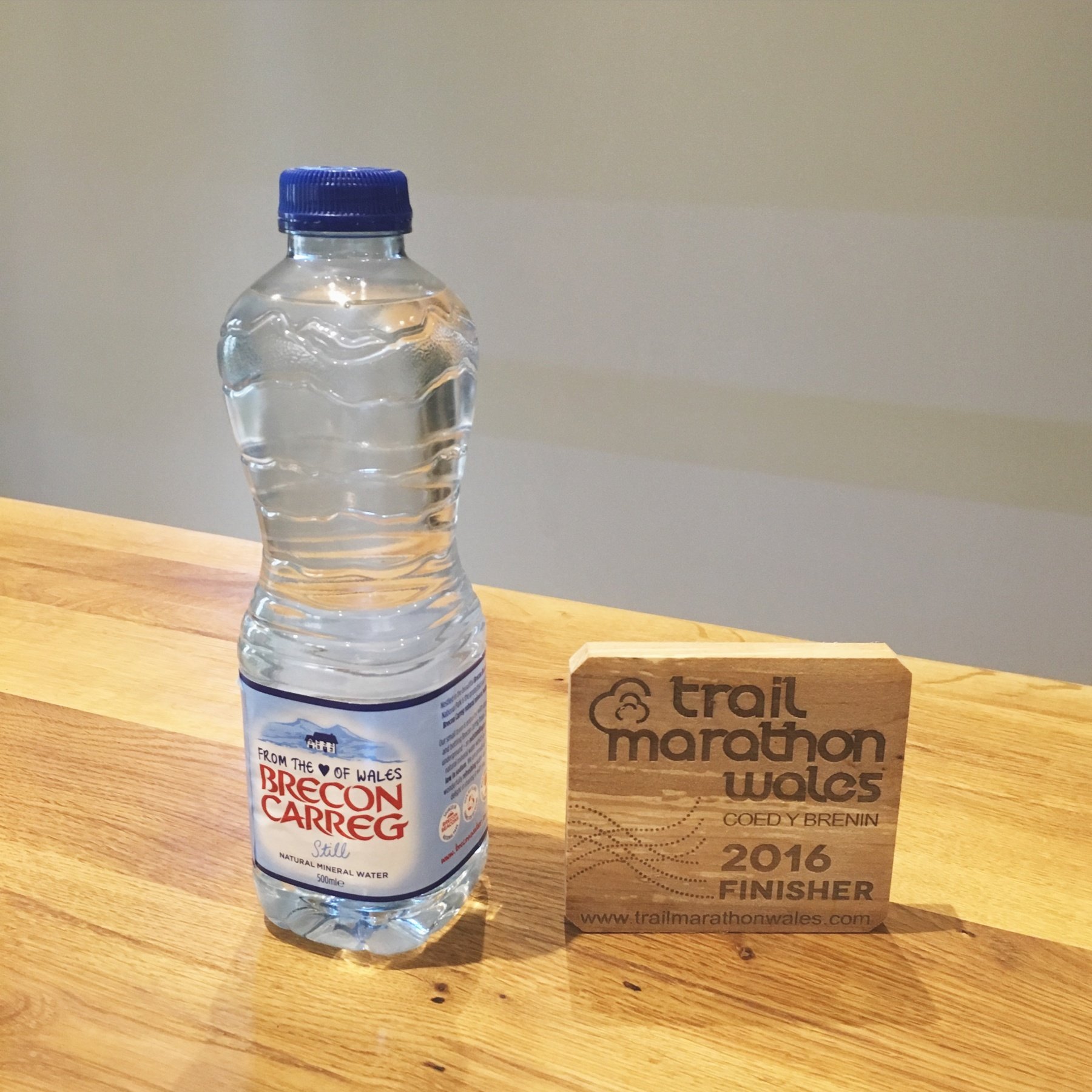 Tastes Brecon Carreg water and Trail Marathon Wales 2016 wooden coaster