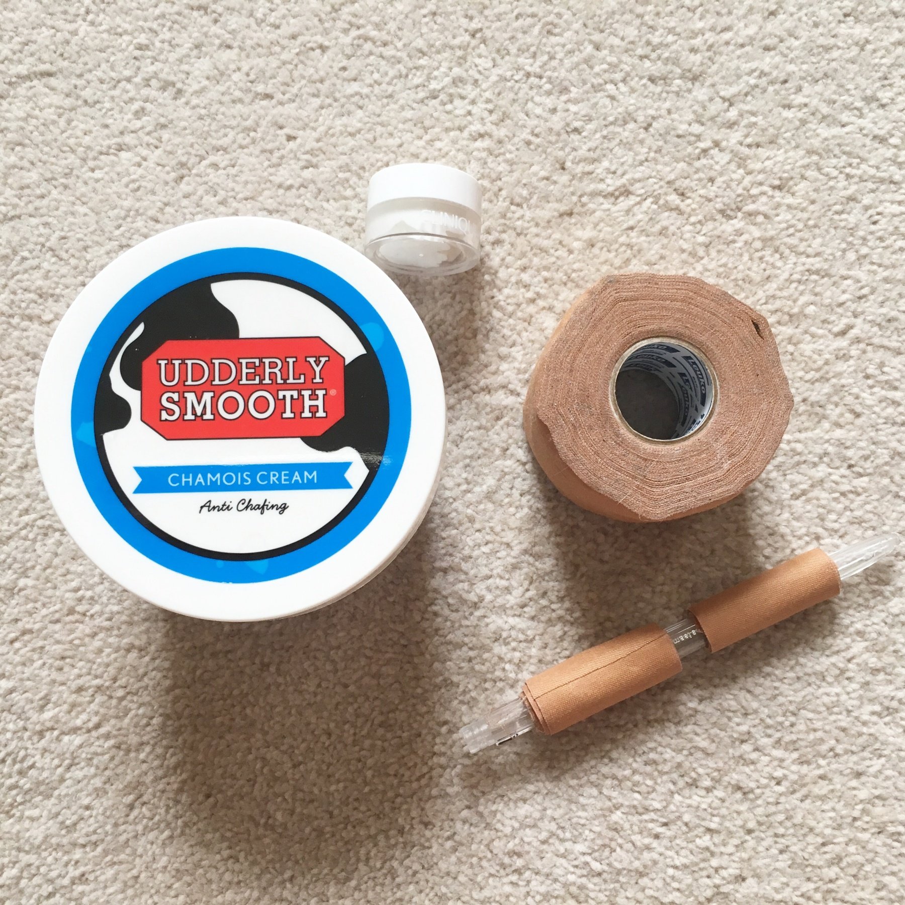 Decanting chamois cream into a small tub, and rolling Leukotape onto an empty biro to carry with me.