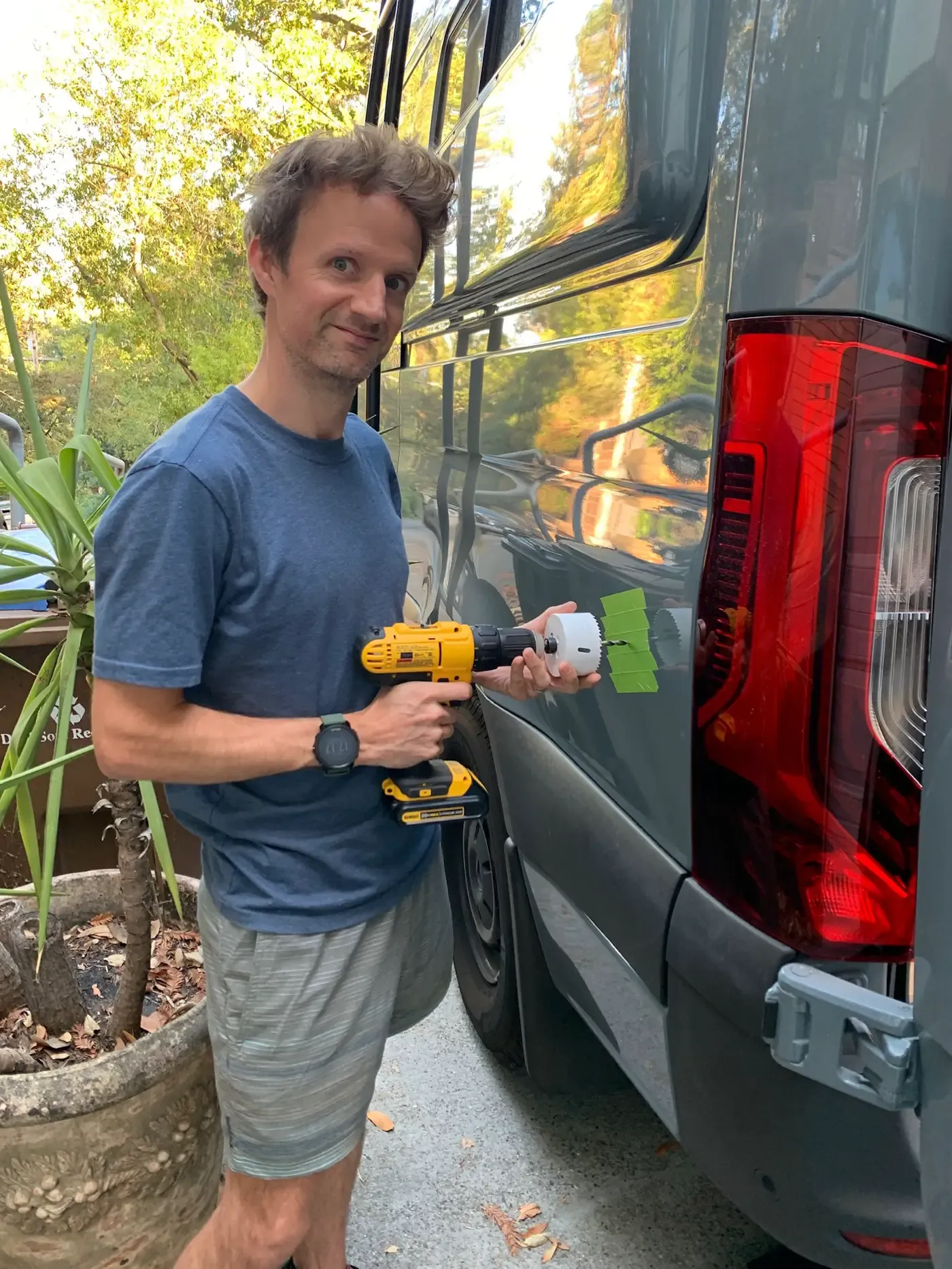Me cutting a hole in our van