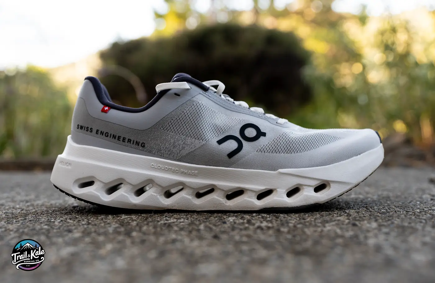 On Cloudsurfer Next side profile showcasing engineered woven upper and CloudTec sole