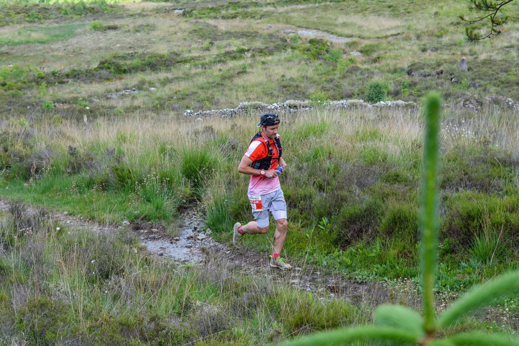 Running through a wet rocky single track section, you can't see from the photo but the views were amazing! Photo credit: SportpicturesCymru