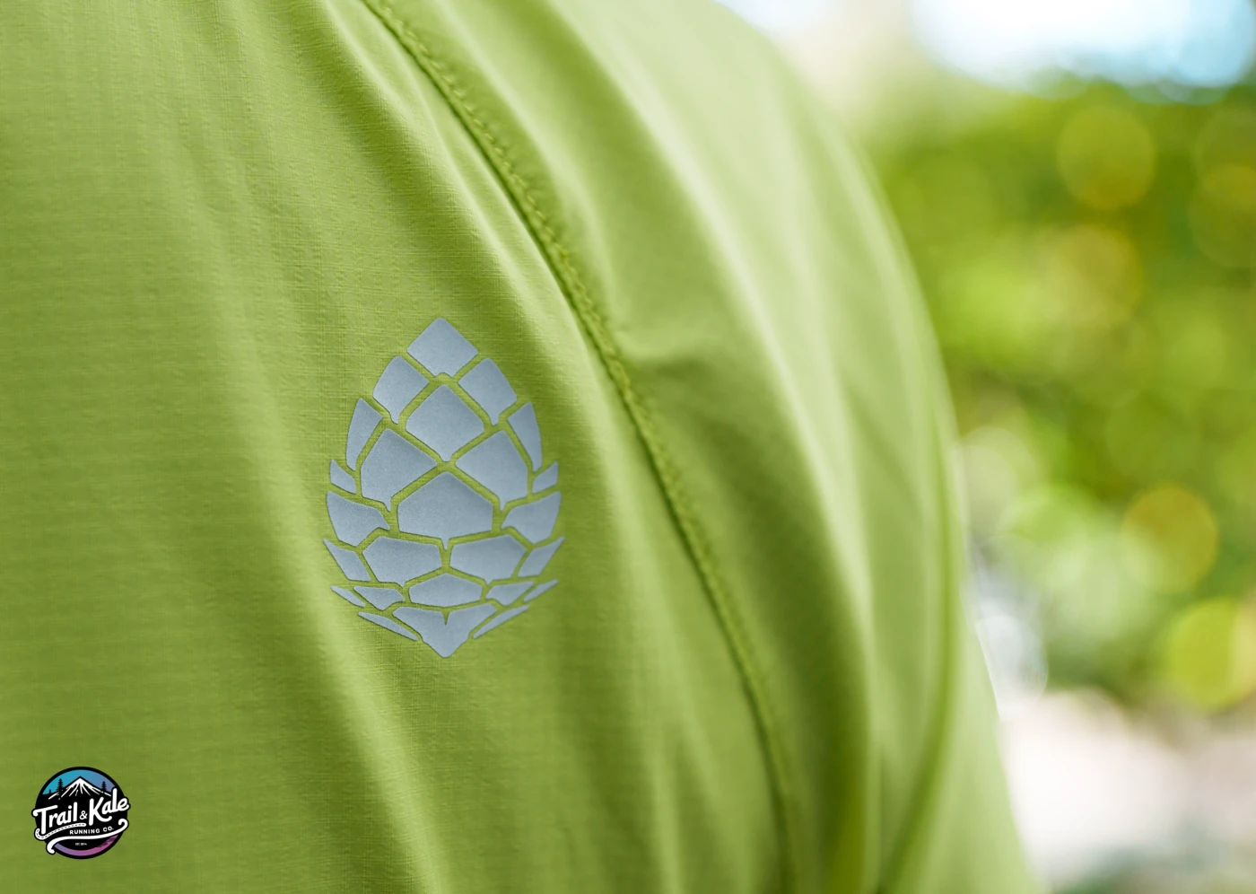 Reflective Stio brand pinecone detail on the Second Light windshell