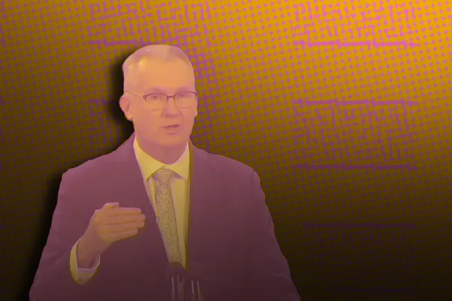 Collage of a man in a suit and tie speaking at a lectern, against an orange halftone background