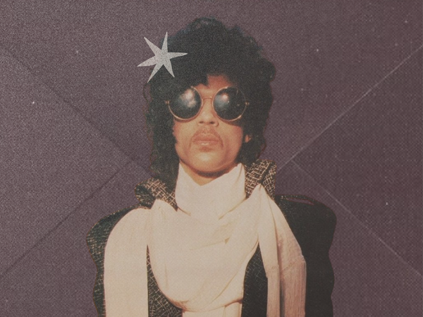 Prince in round sunglasses and a cream fringed scarf against a purple background