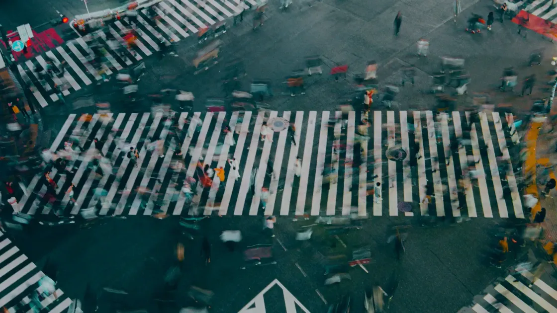 Aerial view of a busy pedestrian crossing in Asia, suggesting fast moving, diverse APAC talent markets for 2025 employer branding.