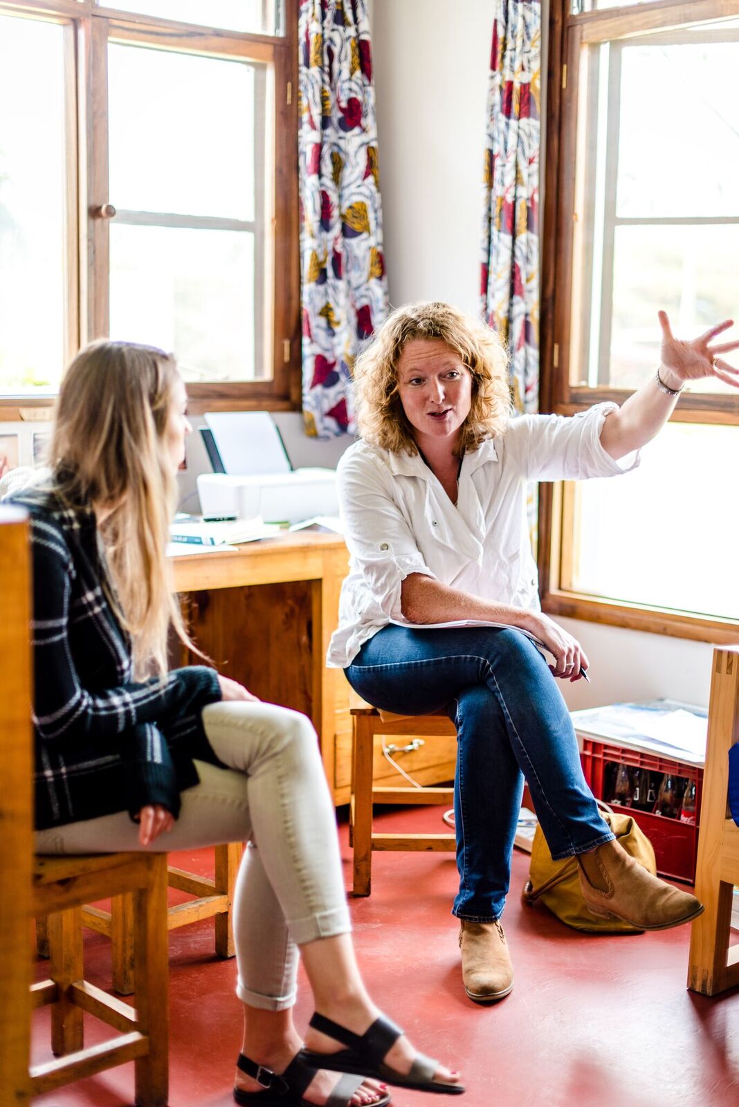 Sarah and Katya speaking at Plaster House in Tanzania