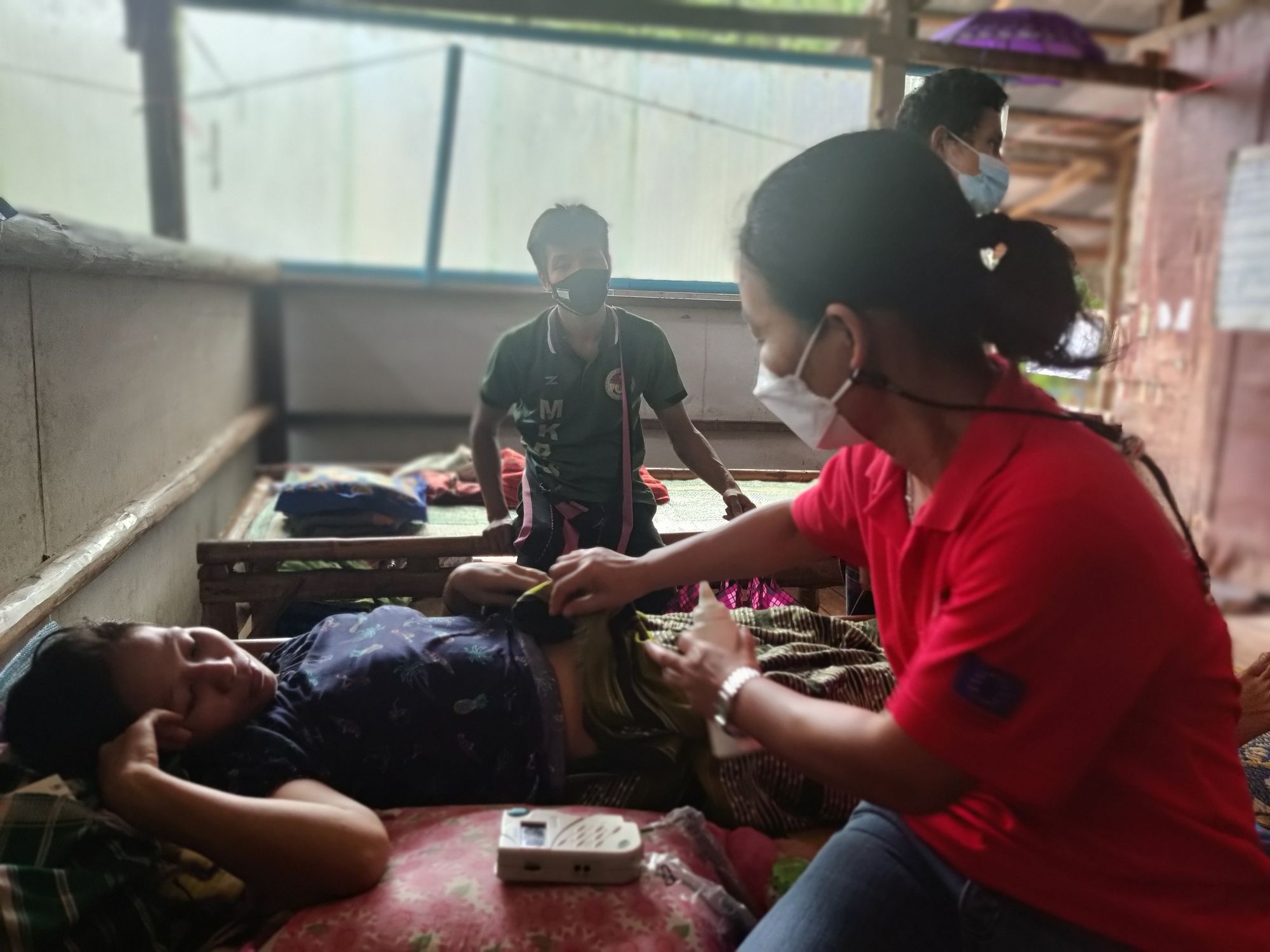 Malteser International staff attending to a patient at the refugee camp