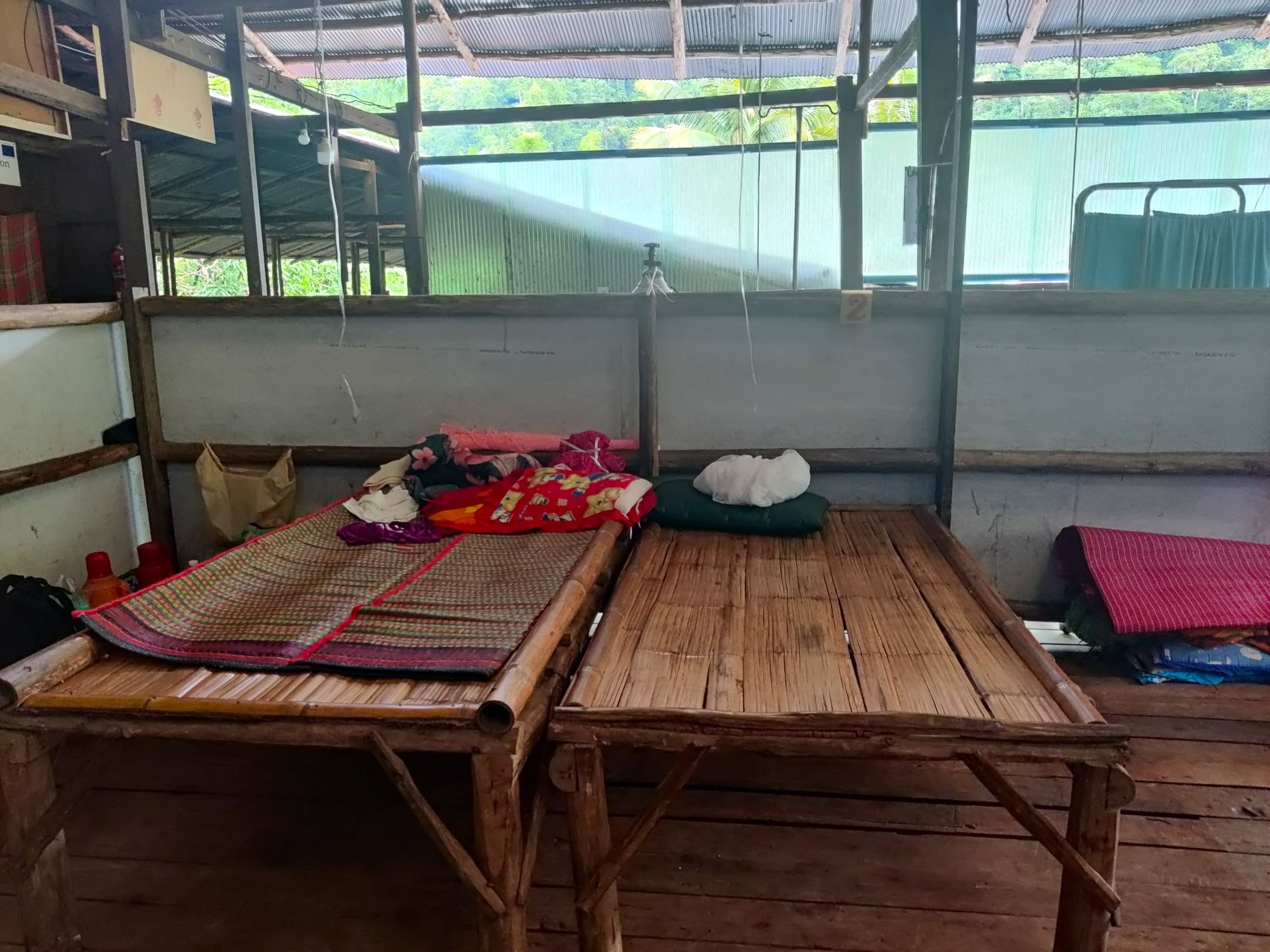 The hospital beds have been roughly built from nearby wood and covered in bamboo mats for easy washing.