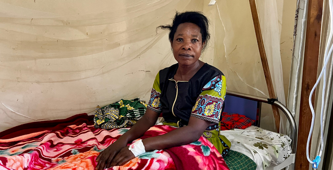 Photo of Judith in bed recovering from her surgery