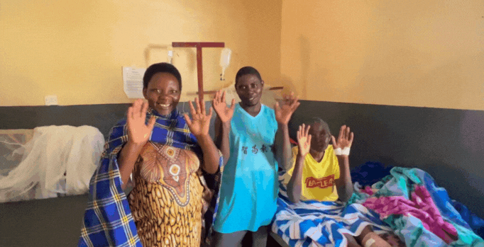 Photo of Buradini with her family waving good byes