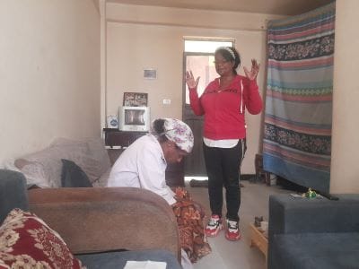 Yonase's mom Misrake & a social worker during their home visit in Ethiopia.