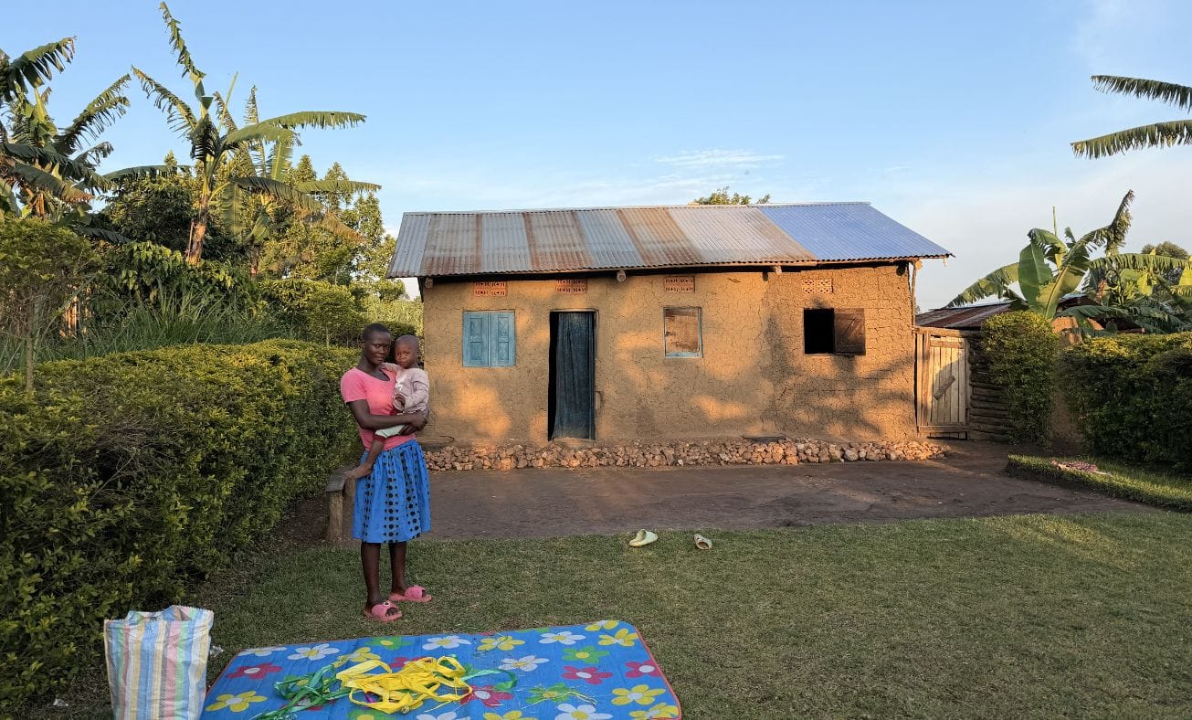 Louis and his aunt bidding us goodbye at their home, accessible only by foot.