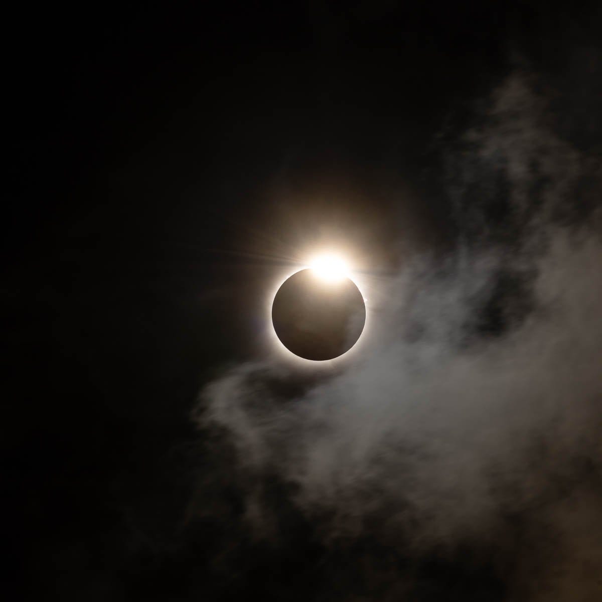A diamond of sunlight piercing from behind the moon during the 2024 total solar eclipse in Oklahoma.