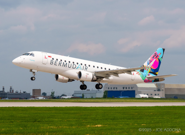A photo of a BermudAir jt taking off from an airport.