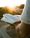 A person reading the Bible in quiet morning light, symbolizing sanctification, holiness, spiritual growth, and becoming more like Christ.