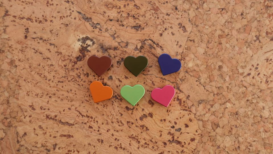 An image of 6 heart speed straddle cable hangers for bicycles. They are sitting on a cork surface.