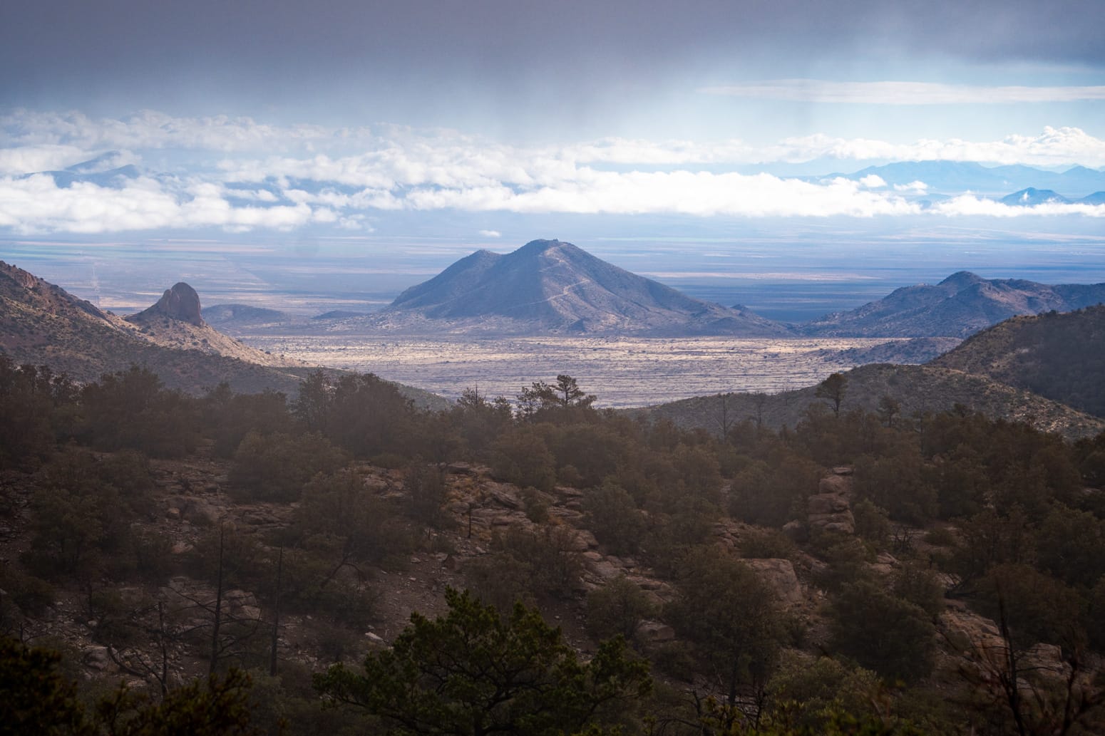 Panoramic views of towering rock formations and surrounding mountains from Massai Point in Chiricahua National Monument, accessible via a short, paved trail to the observation area.